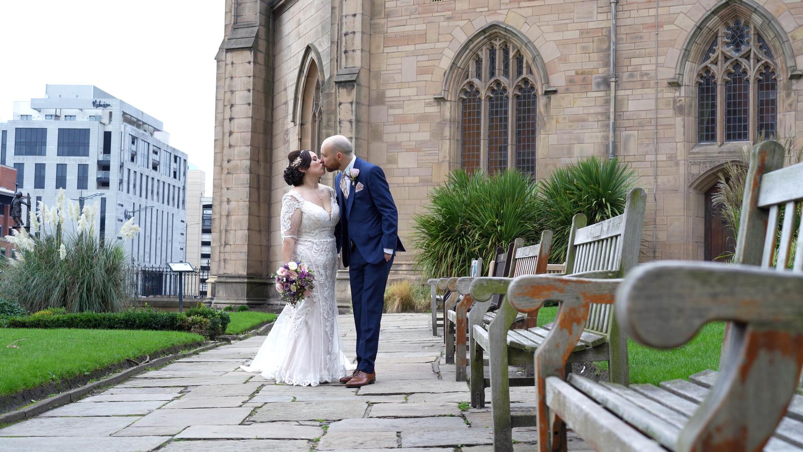 couple kiss outside sailors church in liverpool