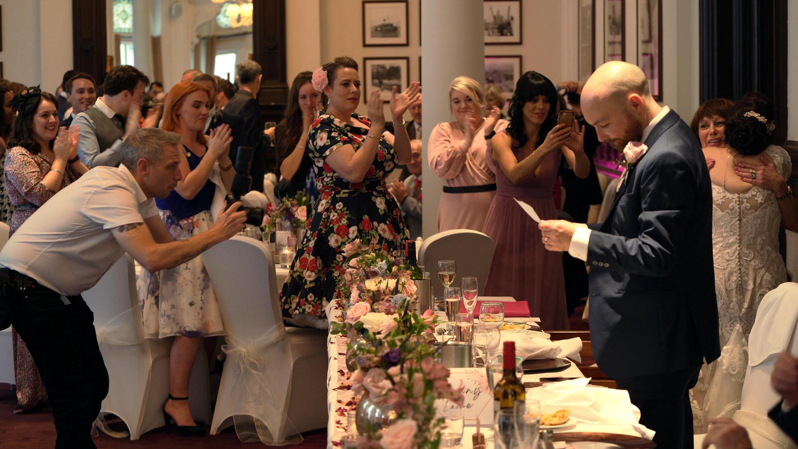 groom stands to do speech in liverpool