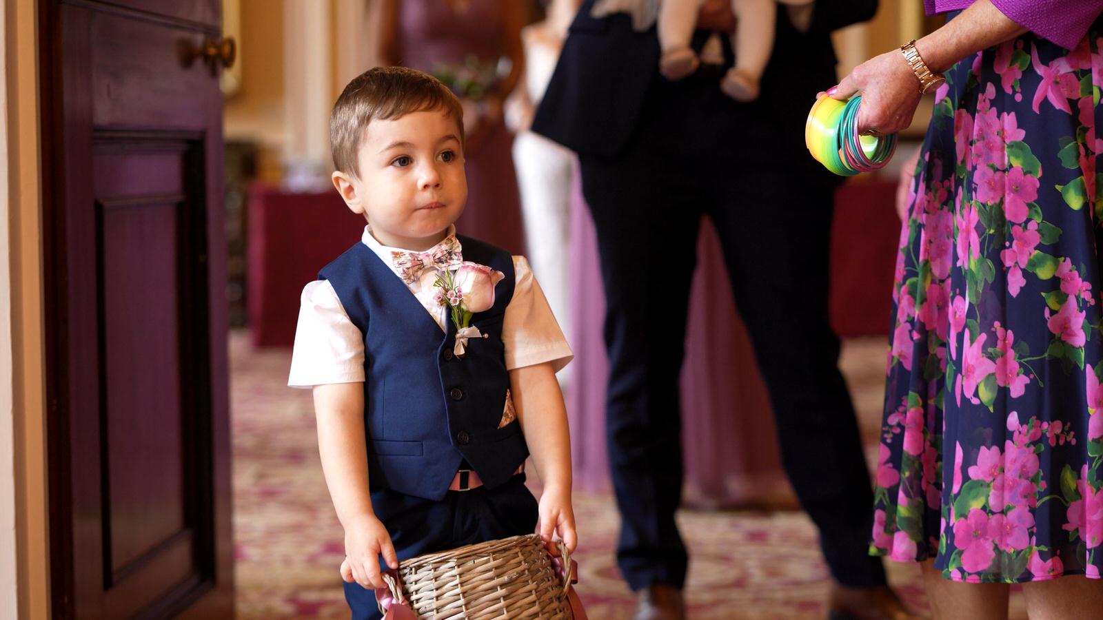 page boy waits for ceremony at town hall