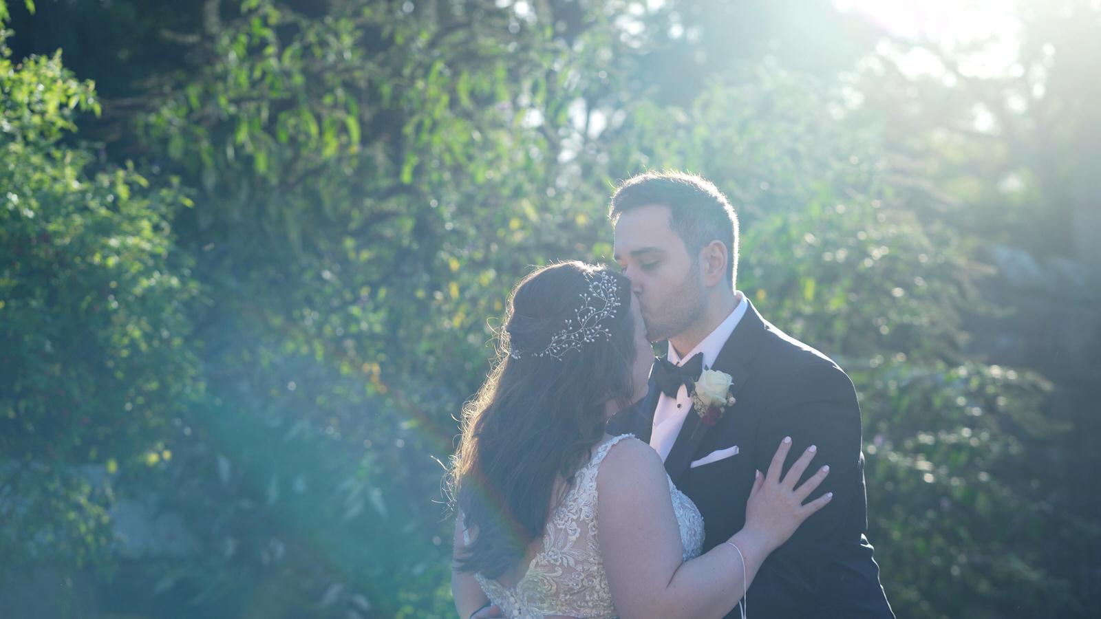 video still of couple kissing at peckforton castle