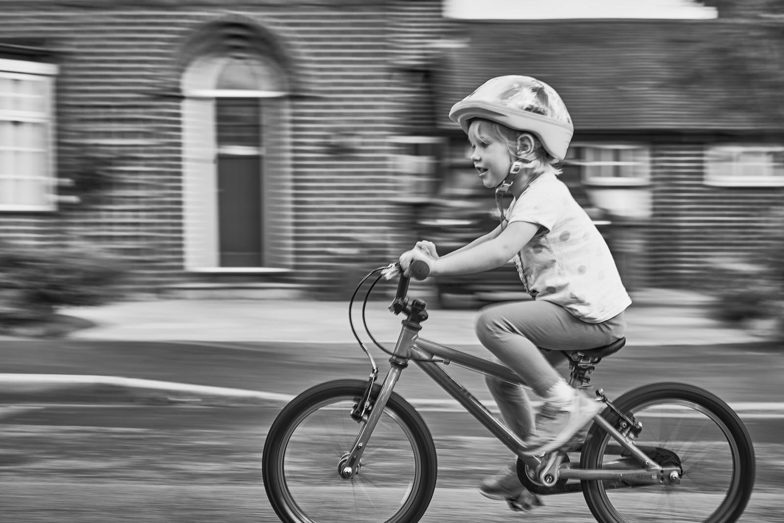 creative motion panning photo of girl on bike