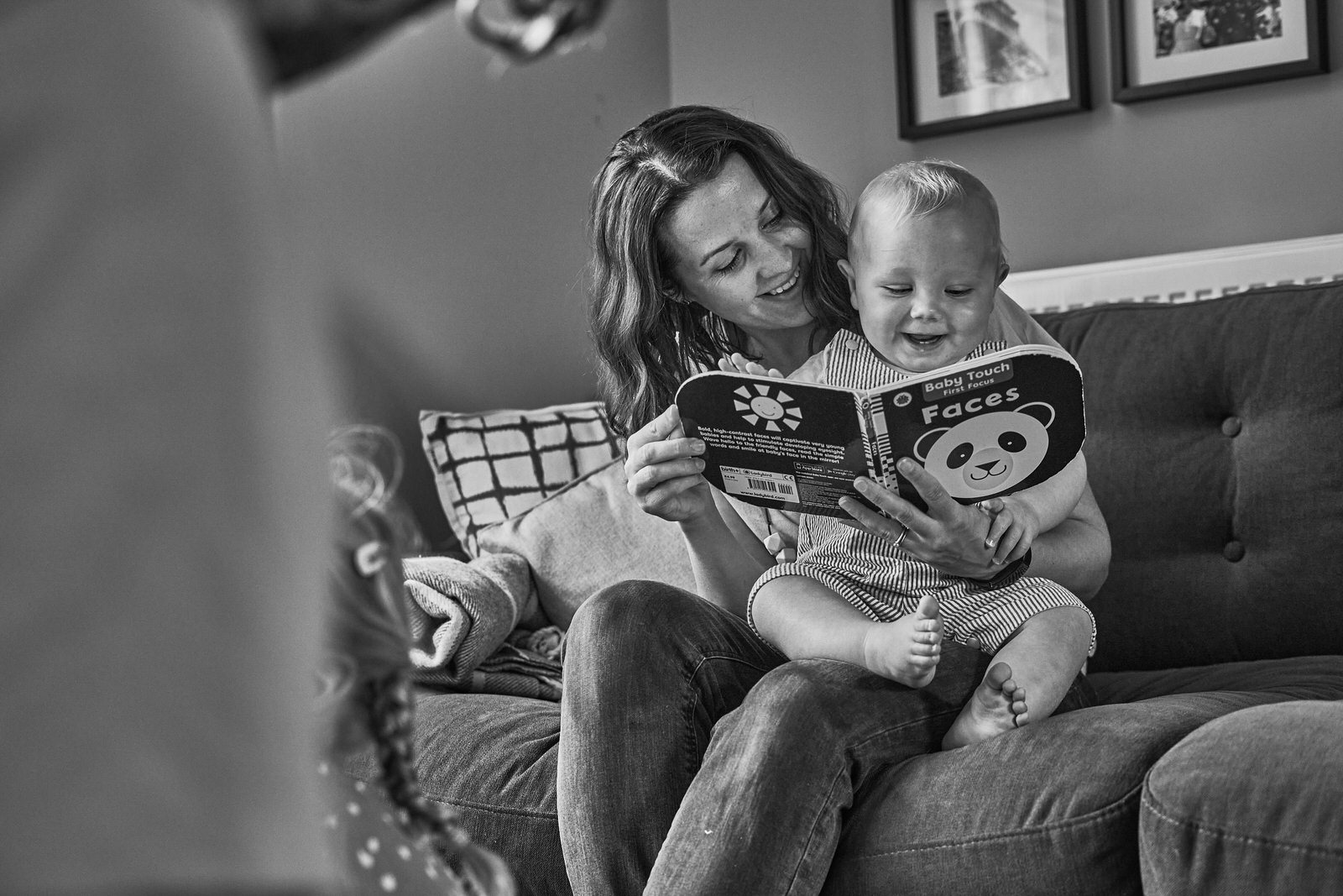 natural photo of mum reading to her baby