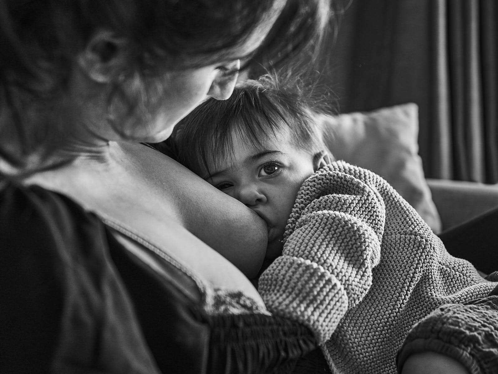 natural photo of toddler breastfeeding