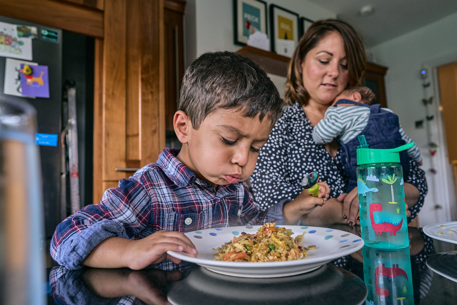 boy blows his lunch to cool it down
