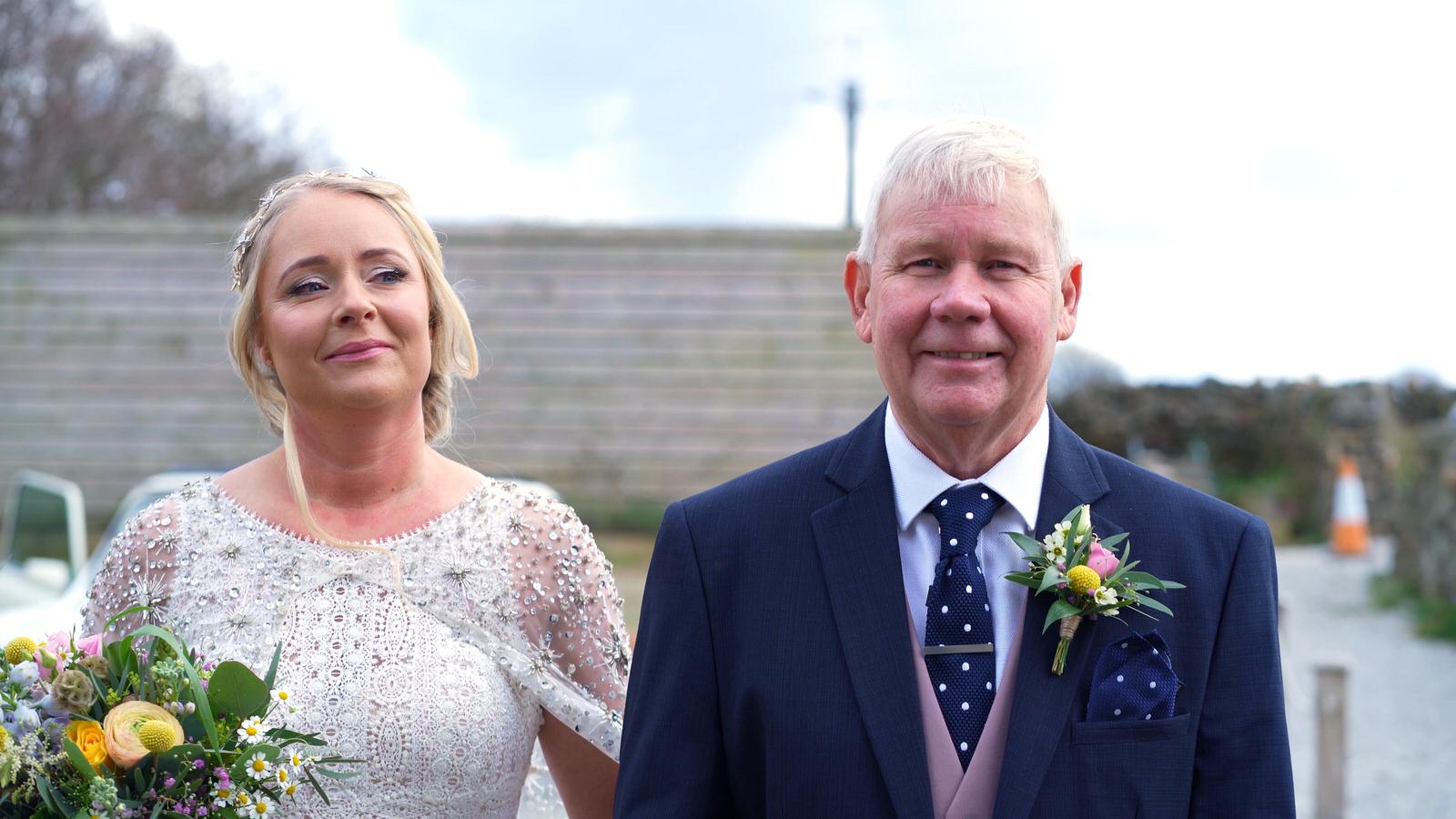 bride gets emotional with dad before wedding ceremony
