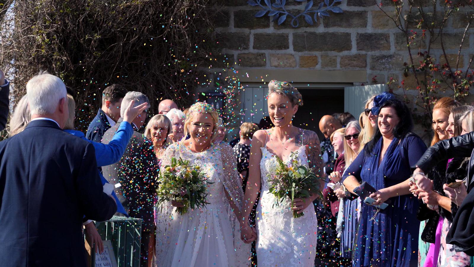 yorkshire wedding videographer films confetti outside Chilli Barn Otley