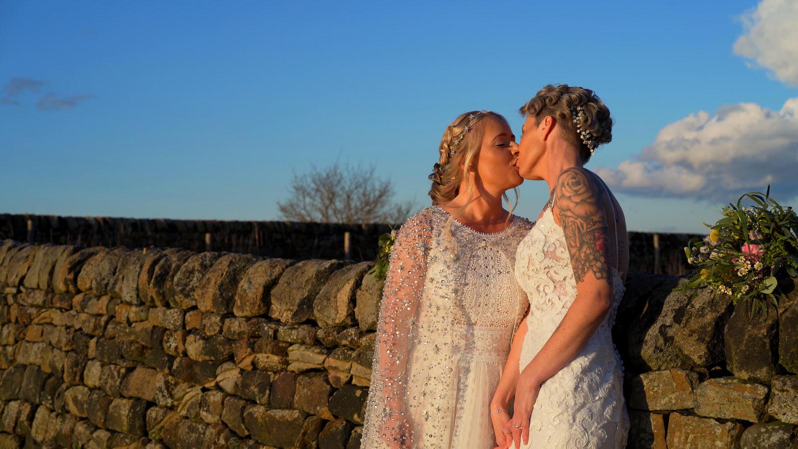 couple kiss in golden hour in Otley Chevin Forest Park
