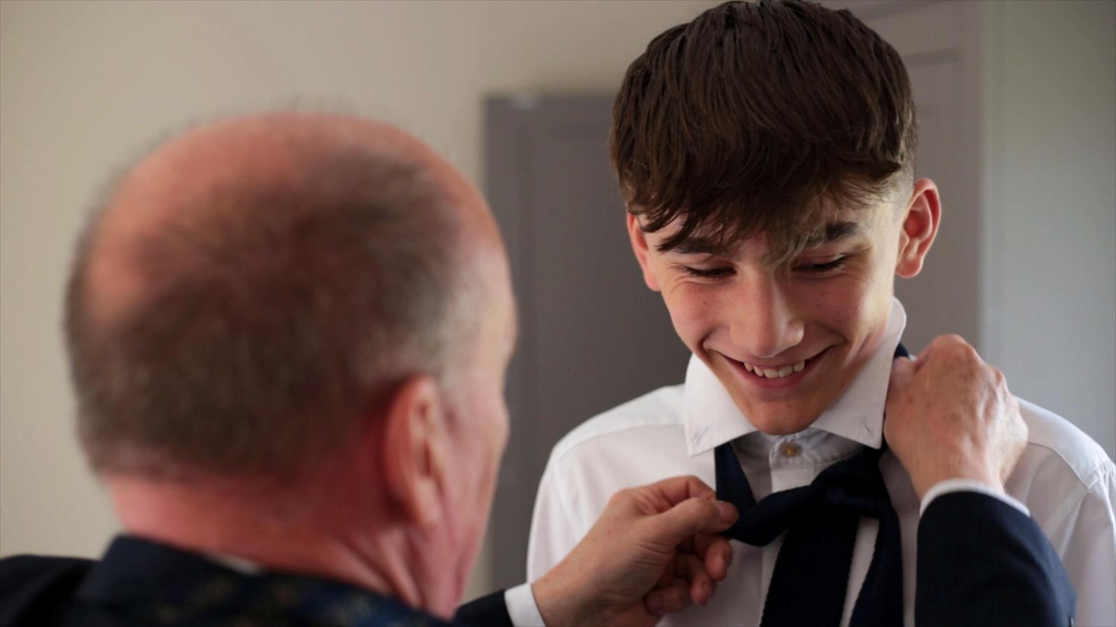brides son has wedding tie fixed