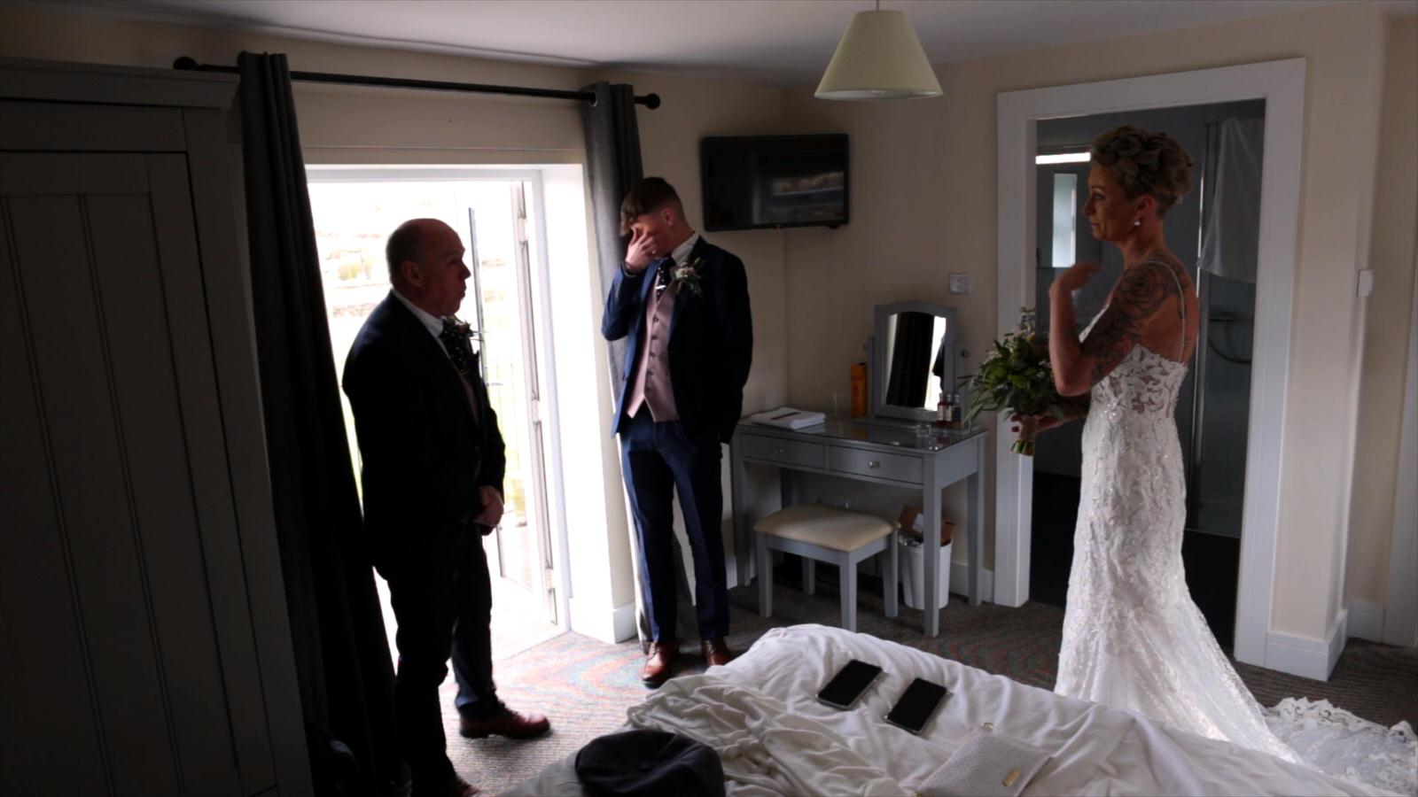 brides dad and son get emotional on wedding video