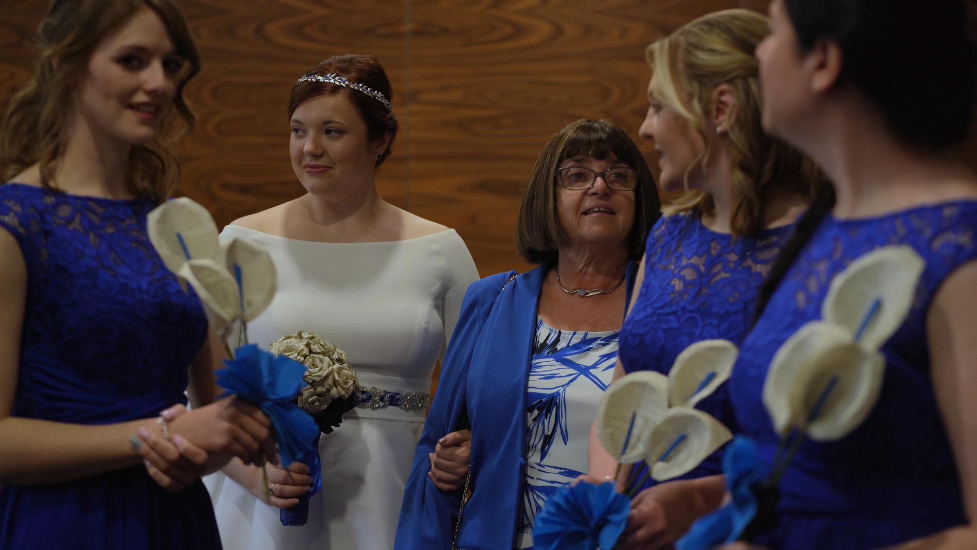 bride takes a breath before walking down the aisle