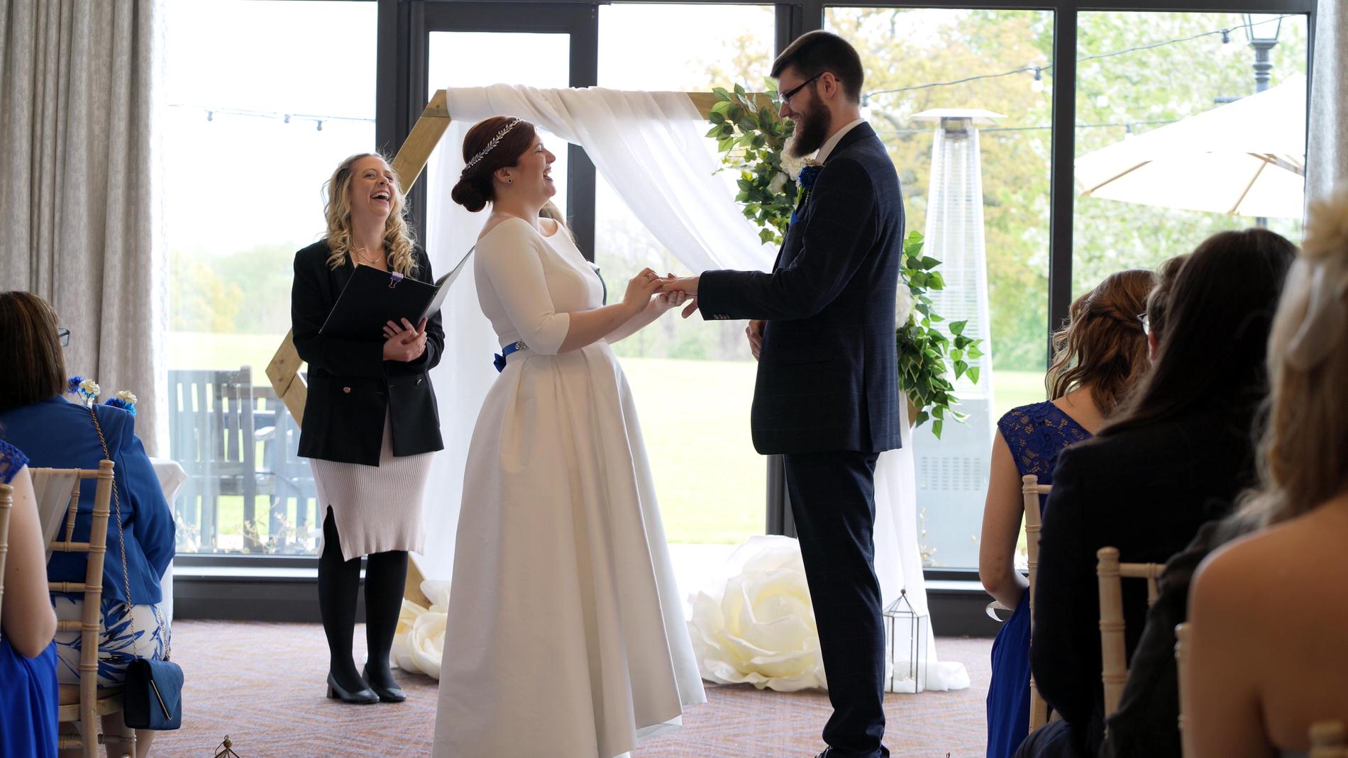 couple laugh during wedding vows at Rookery Hall