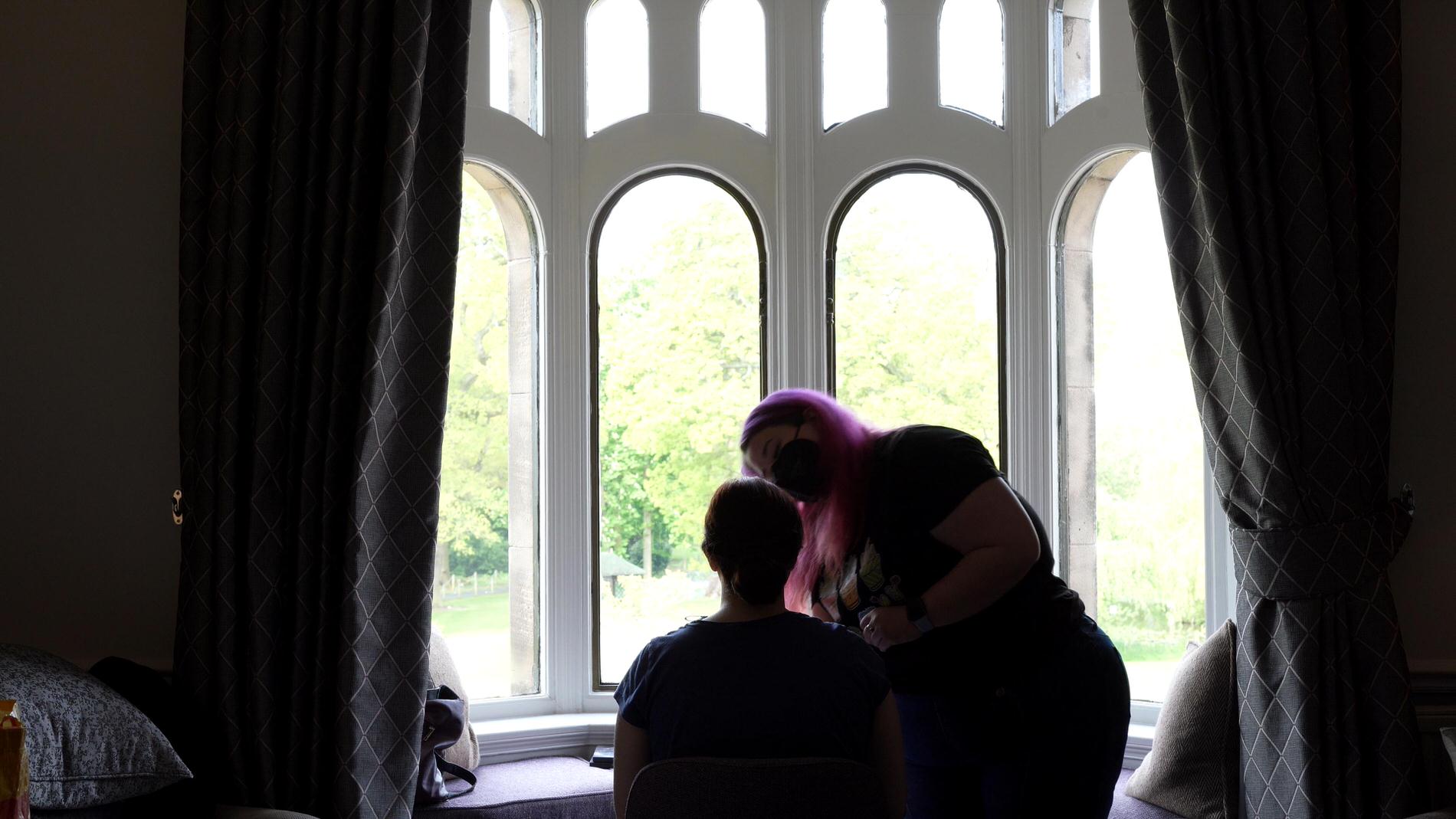 bride has makeup done in bridal suite at Rookery Hall