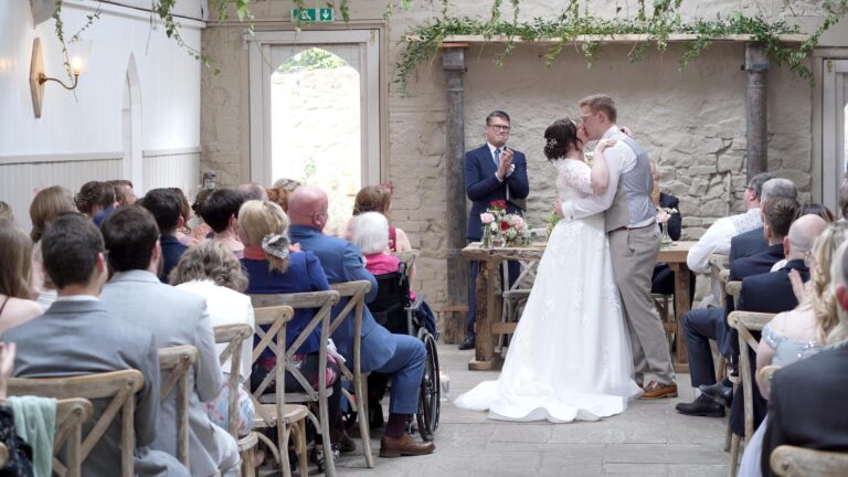 couple kiss during barn ceremony at Wyresdale Park lancashire