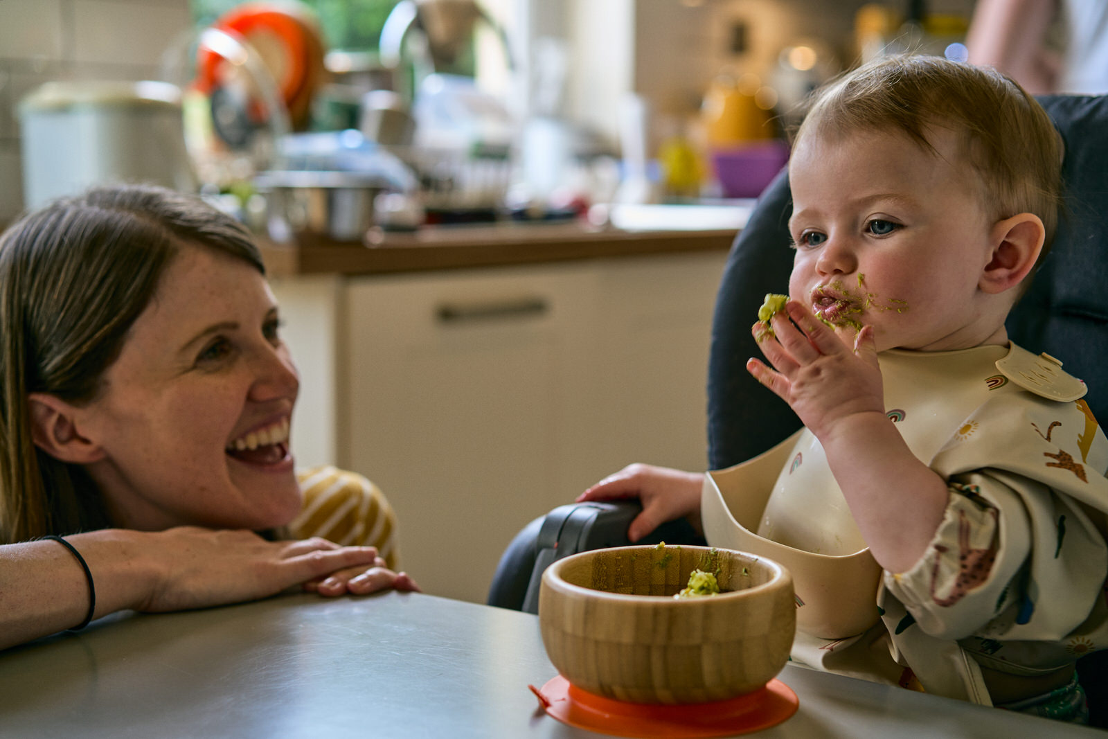 natural photo of mum and baby during meal time