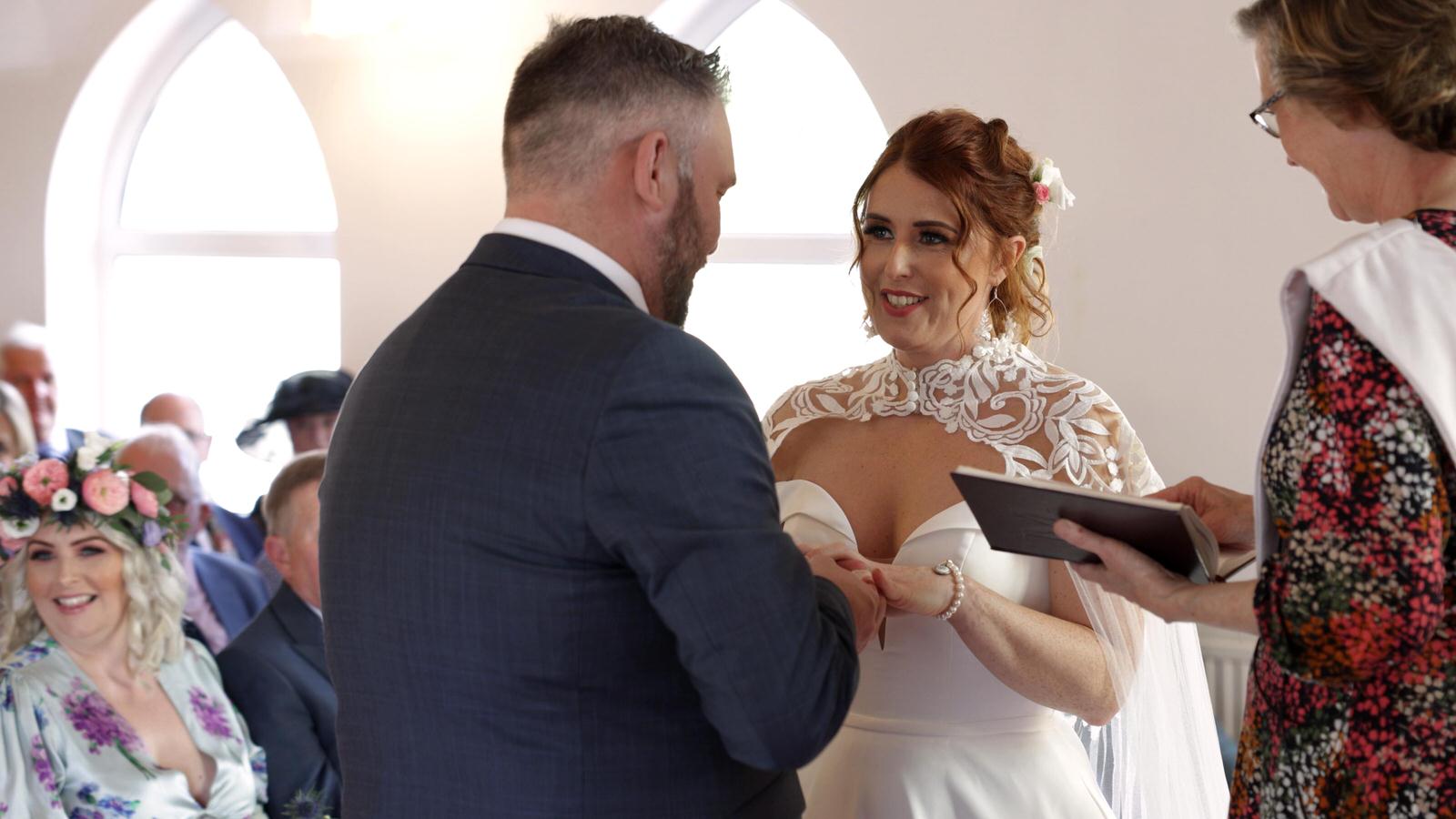 the couple exchange wedding rings