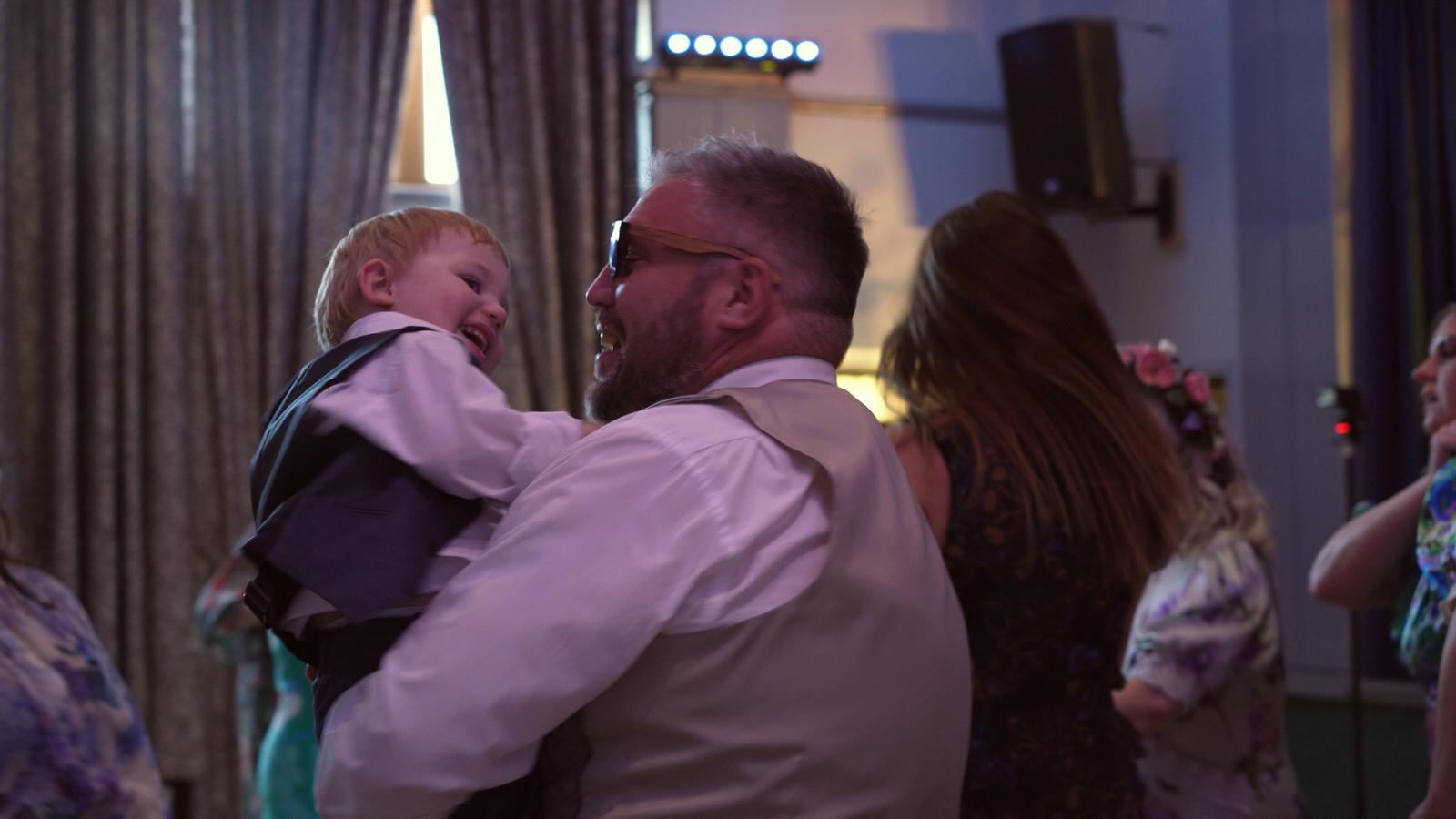 groom dances with his son