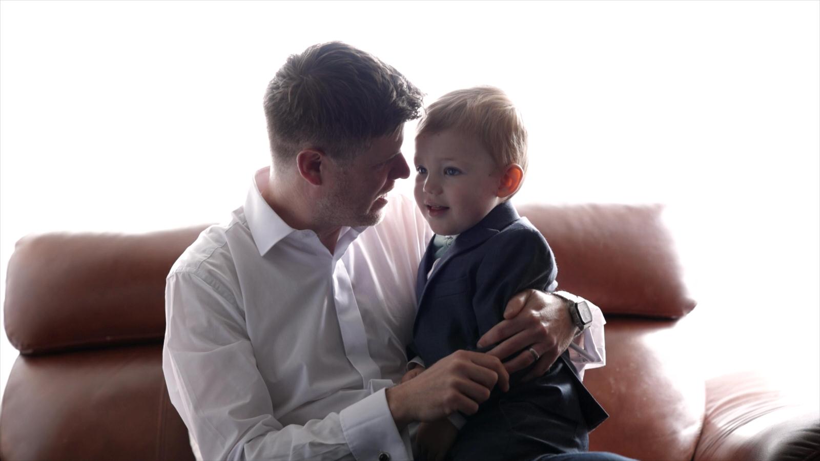 the best man and page boy have a cuddle