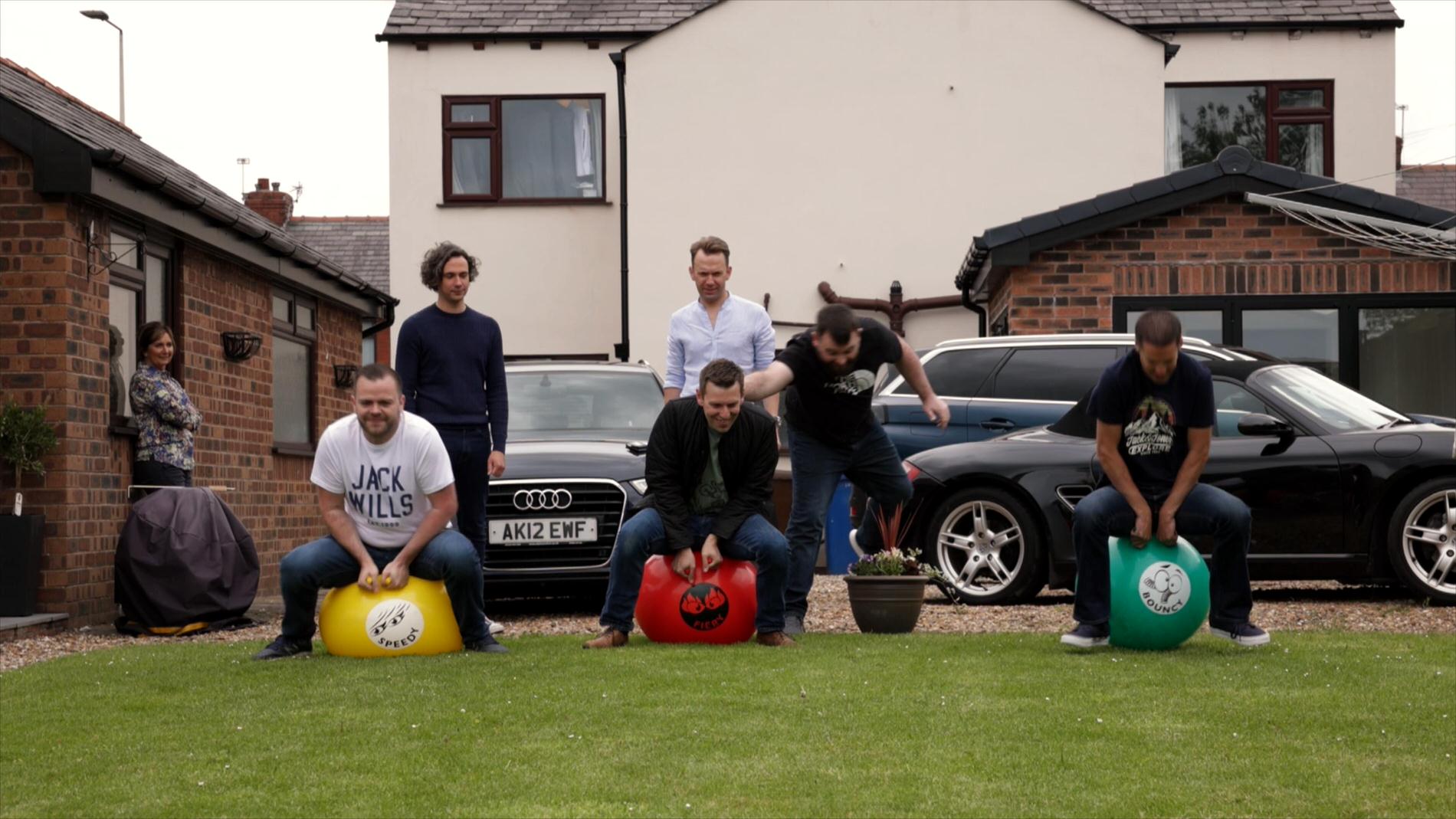 groomsmen practice on space hoppers