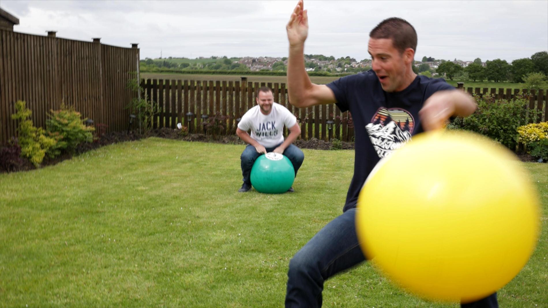 video still of best man falling off space hopper