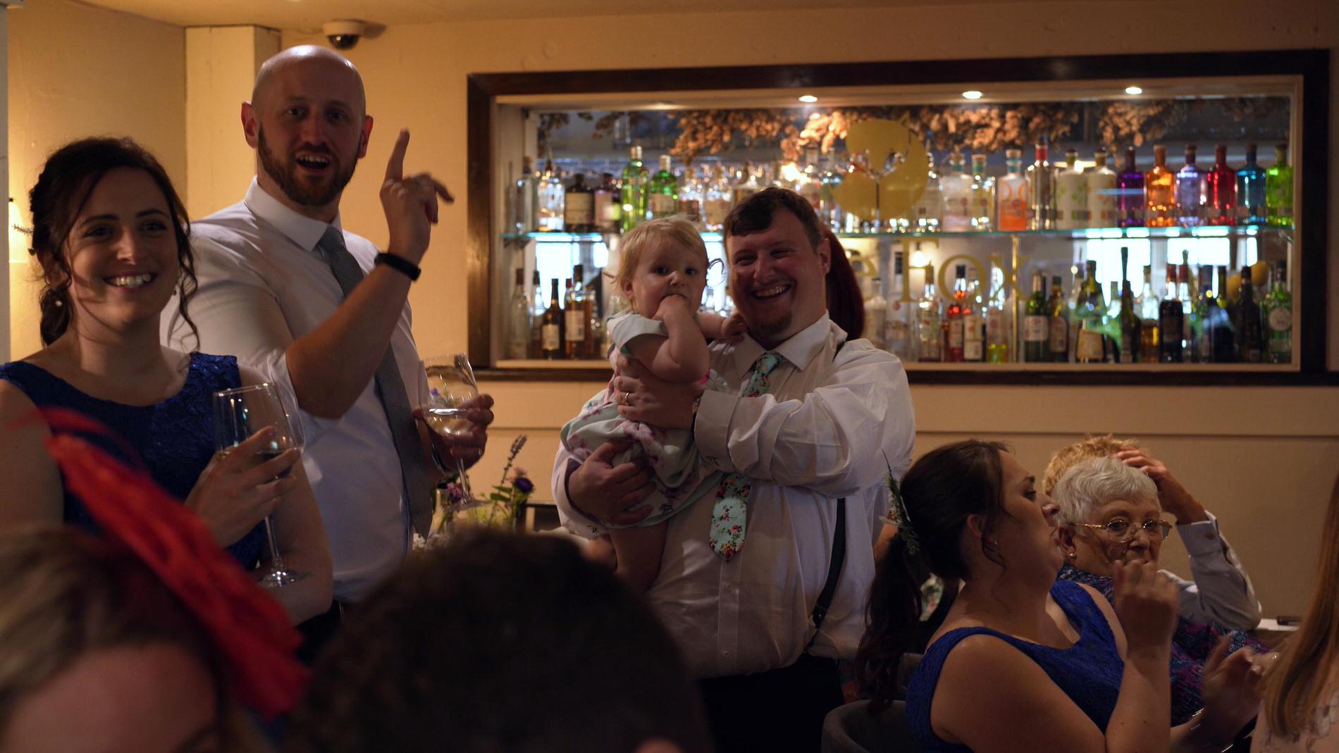 guests sing along with the singing waiters