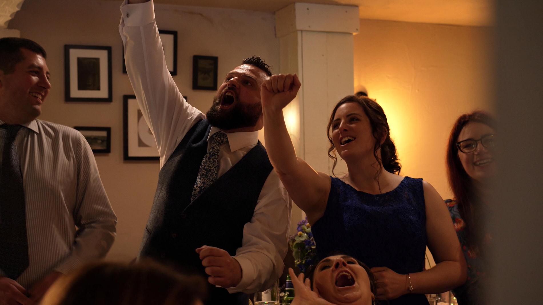 guests enjoying a singing waiters surprise