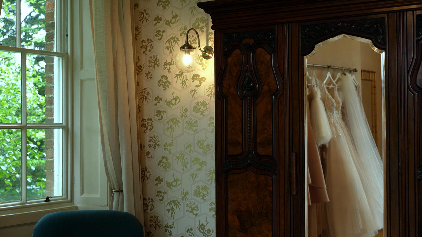 dress hangs in bridal dressing room at Rivington hall barn