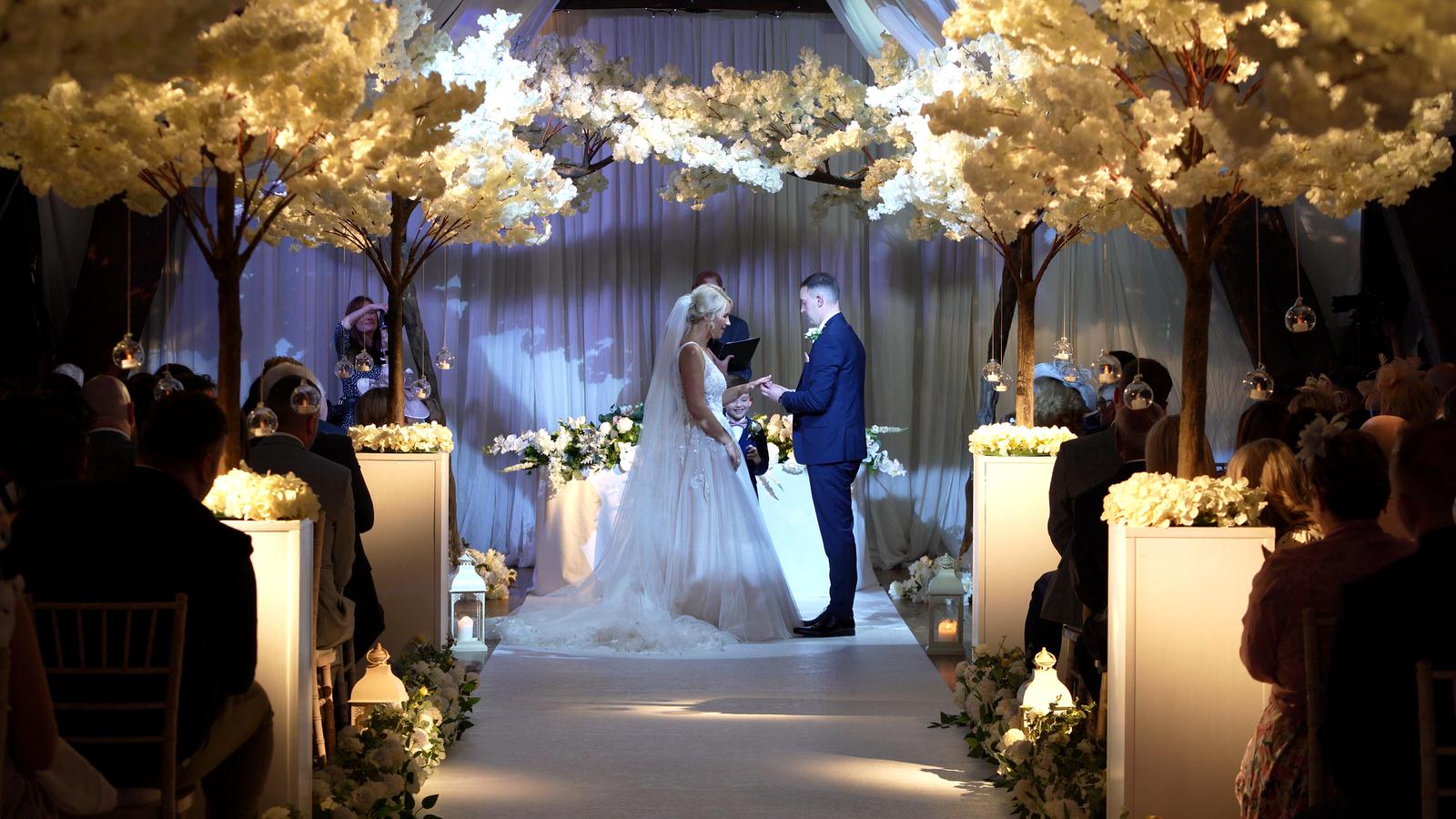 video still of a blossom tree ceremony in Rivington hall barn