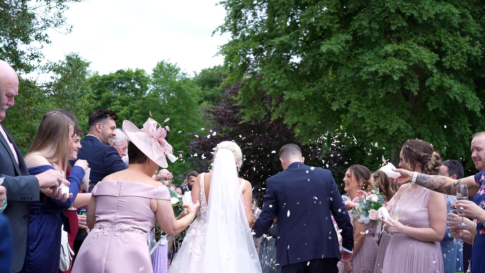 video still of confetti outside Rivington hall barn