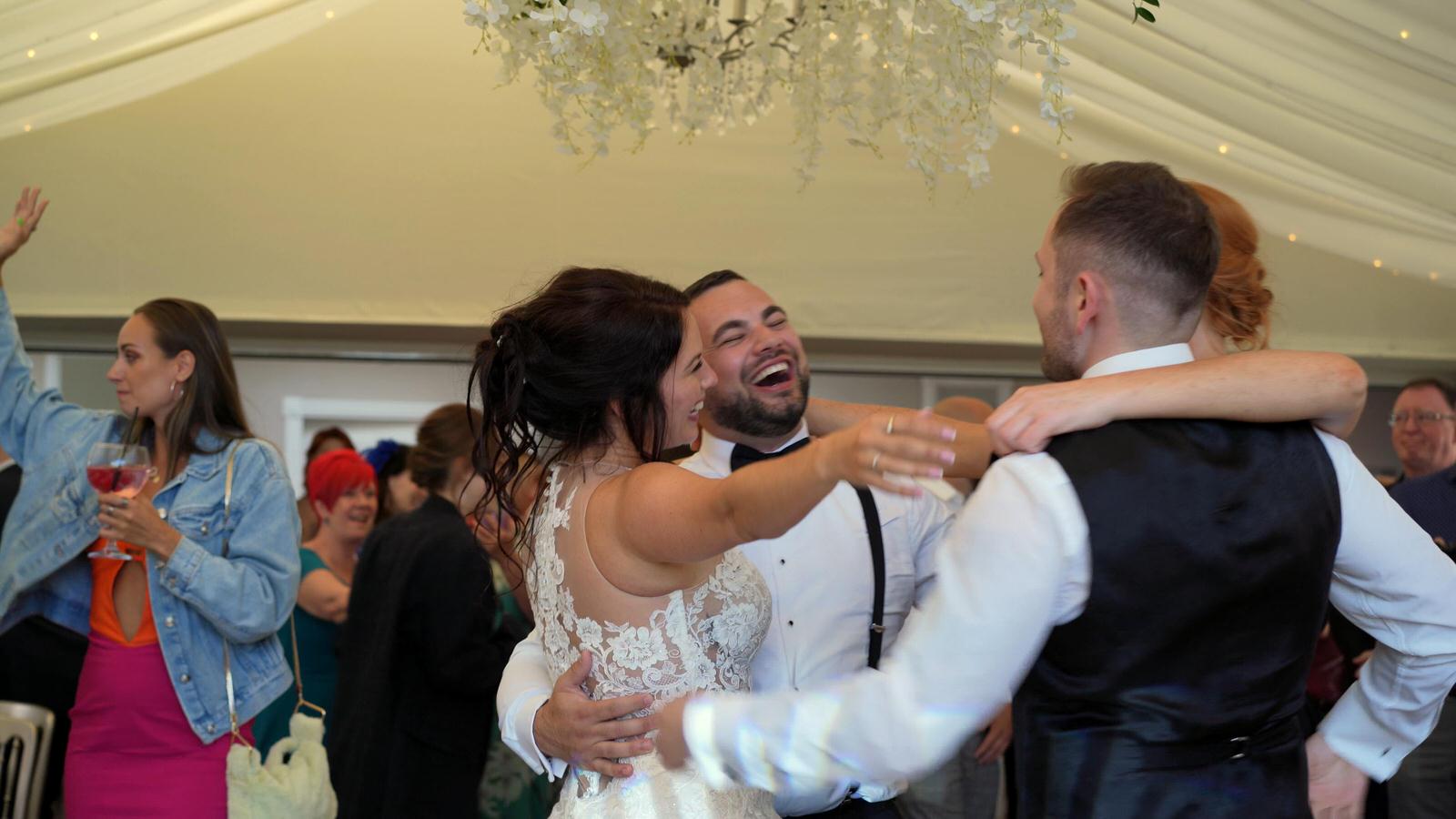 guests join the couple on the dancefloor