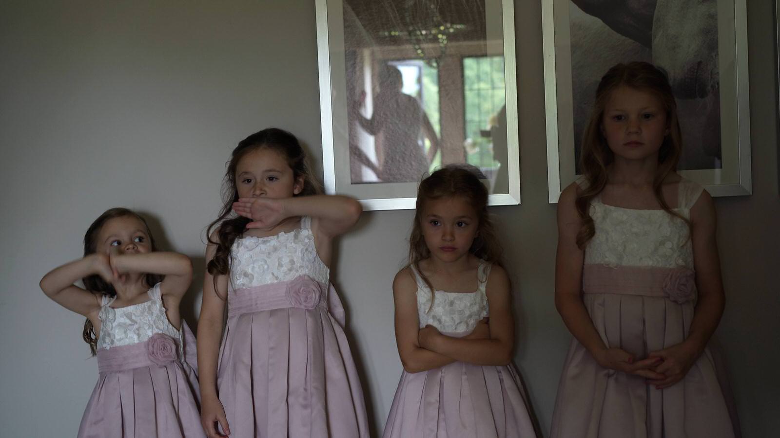 fun video still of flowergirls waiting for wedding