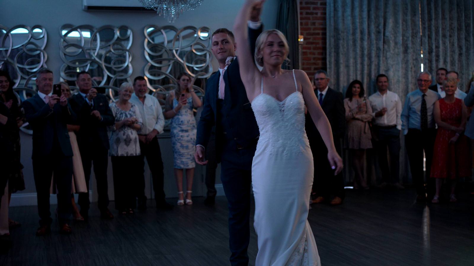 groom spins bride during first dance