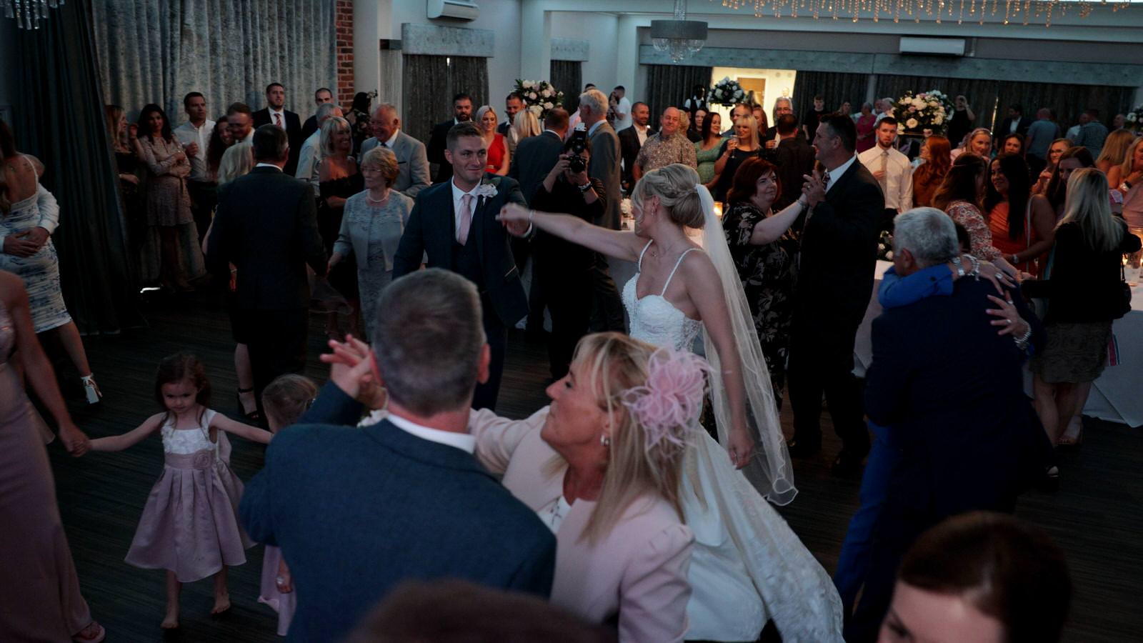 guests all party on the dancefloor at Merrydale