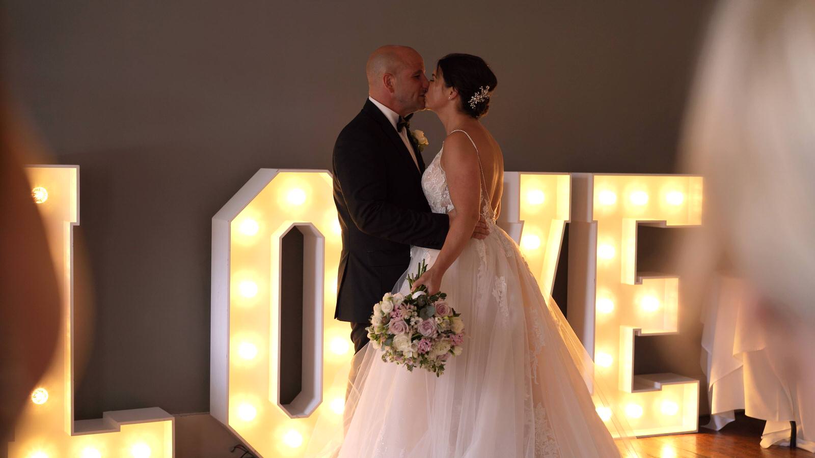 couple kiss at The Castlefield Rooms Manchester