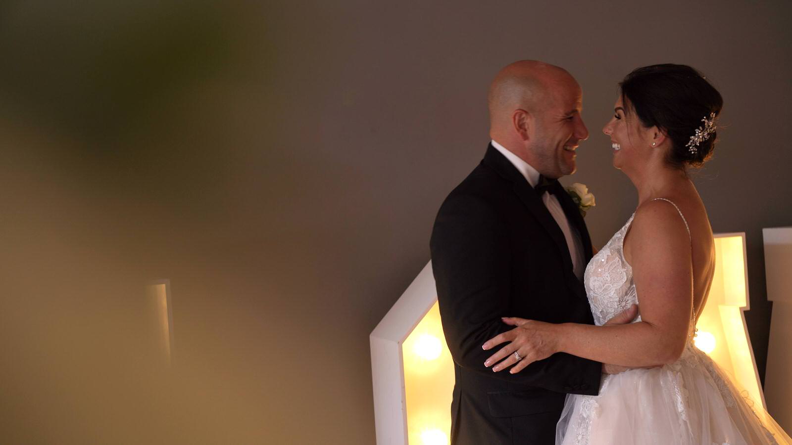 relaxed video shot of bride and groom laughing