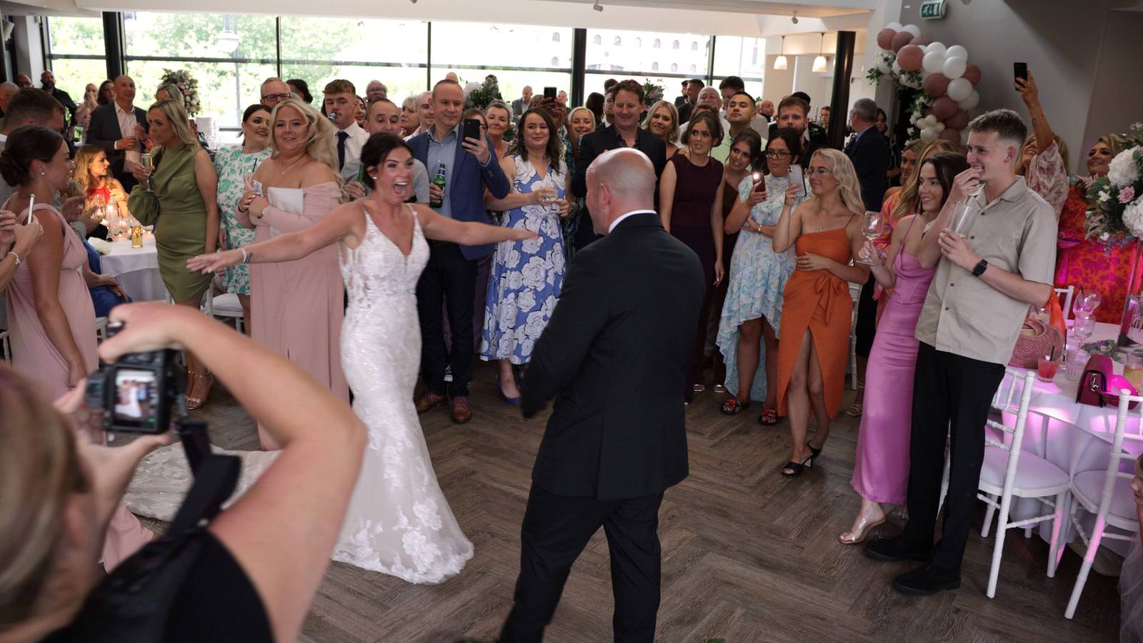 bride surprises groom with a second dress during first dance