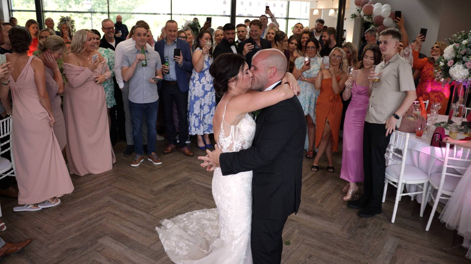 couple kiss during first dance at The Castlefield Rooms Manchester