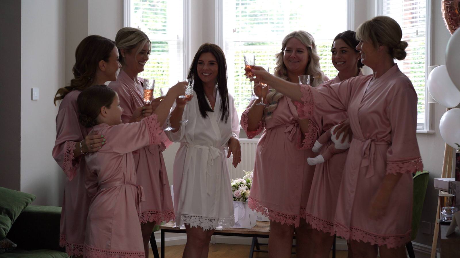 bridesmaids cheer bride on wedding morning