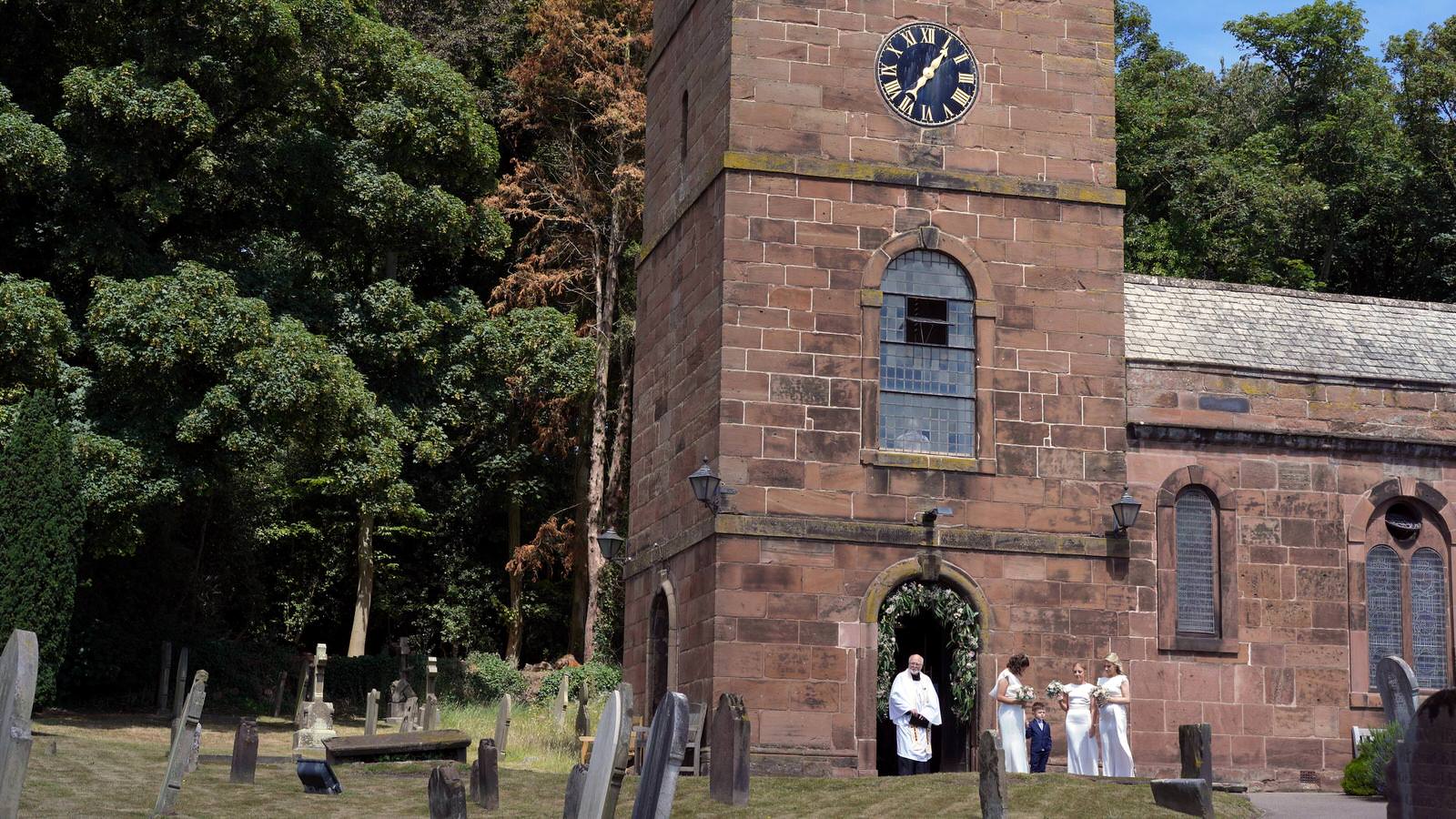 vicar waits outside St Nicholas’s Church burton