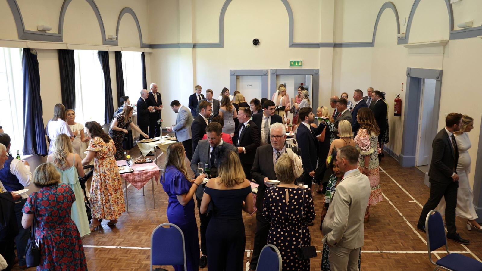 wide video shot of wedding guests at Gladstone Village Hall
