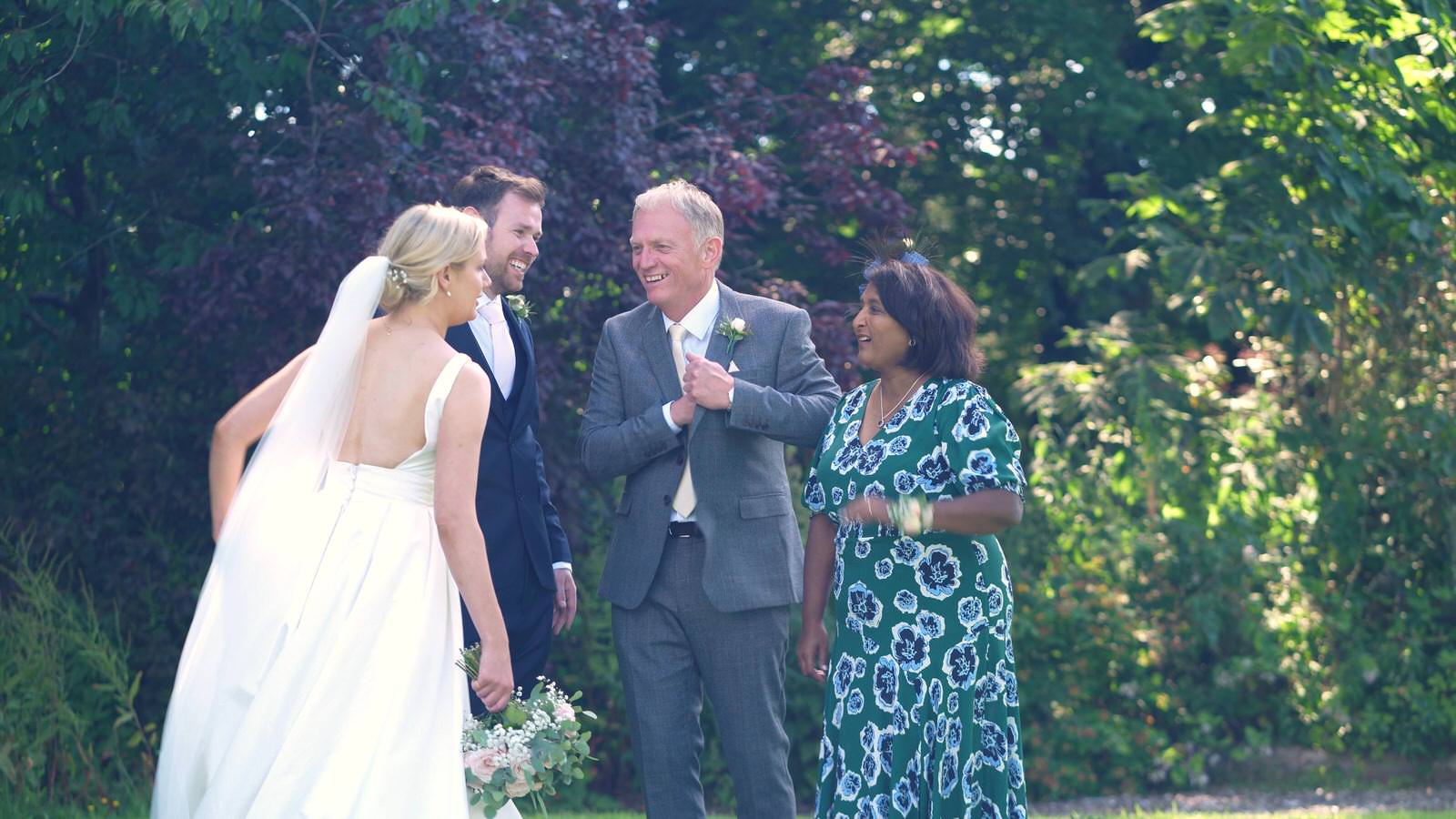 filming family between posed family photos