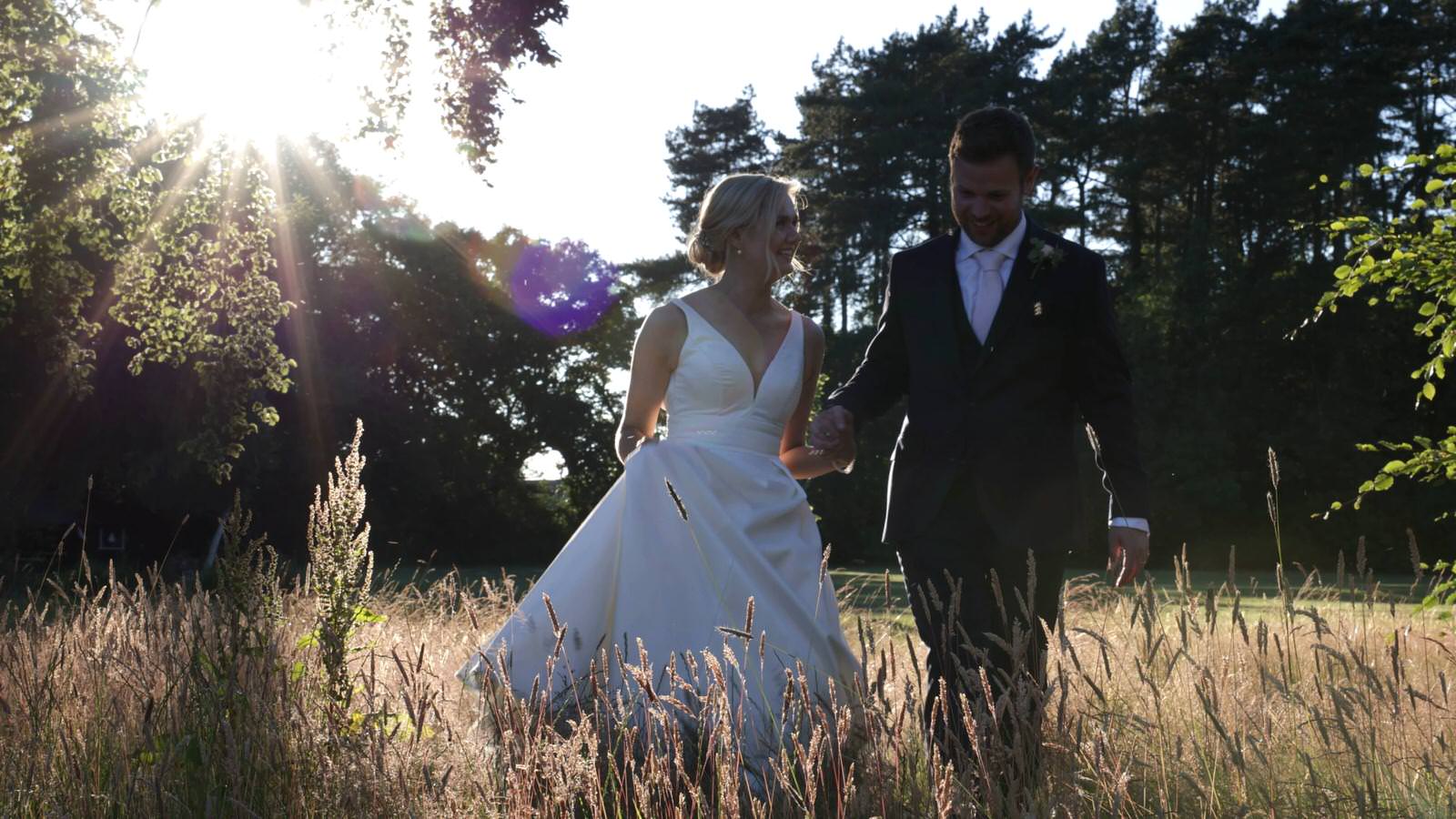video still of couple walking in long grass at Inglewood manor