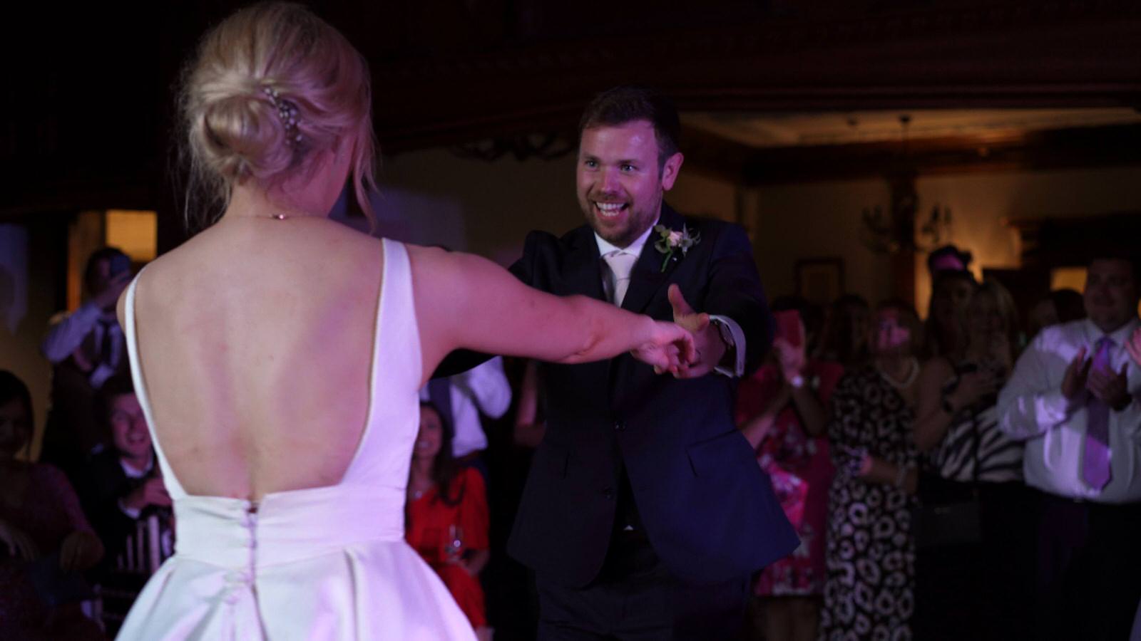 bride and groom have fun dancing at inglewood manor