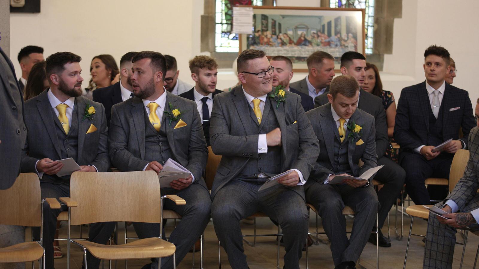 wedding guests sit inside st marys church penwortham