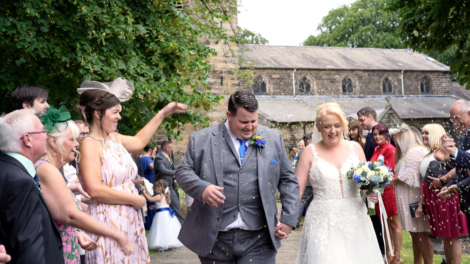 confetti being thrown outside st marys church penwortham