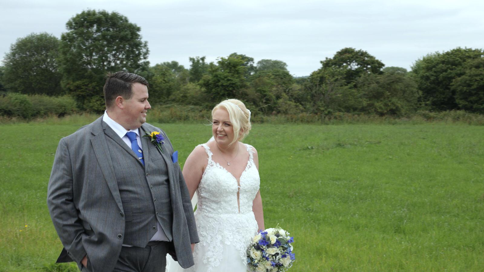 couple laugh walking around Beeston Manor