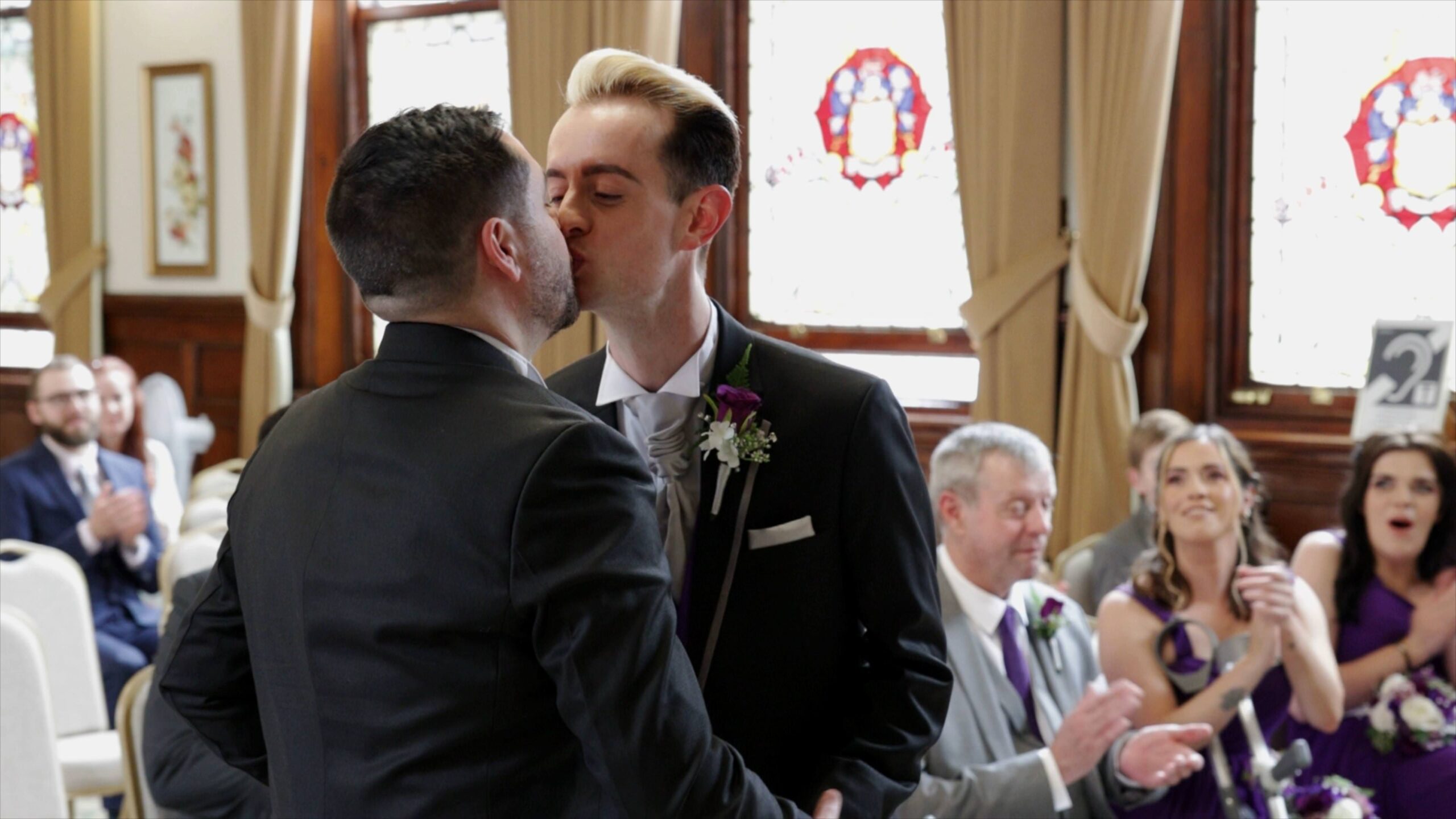 video still of grooms kissing during st helens wedding ceremony