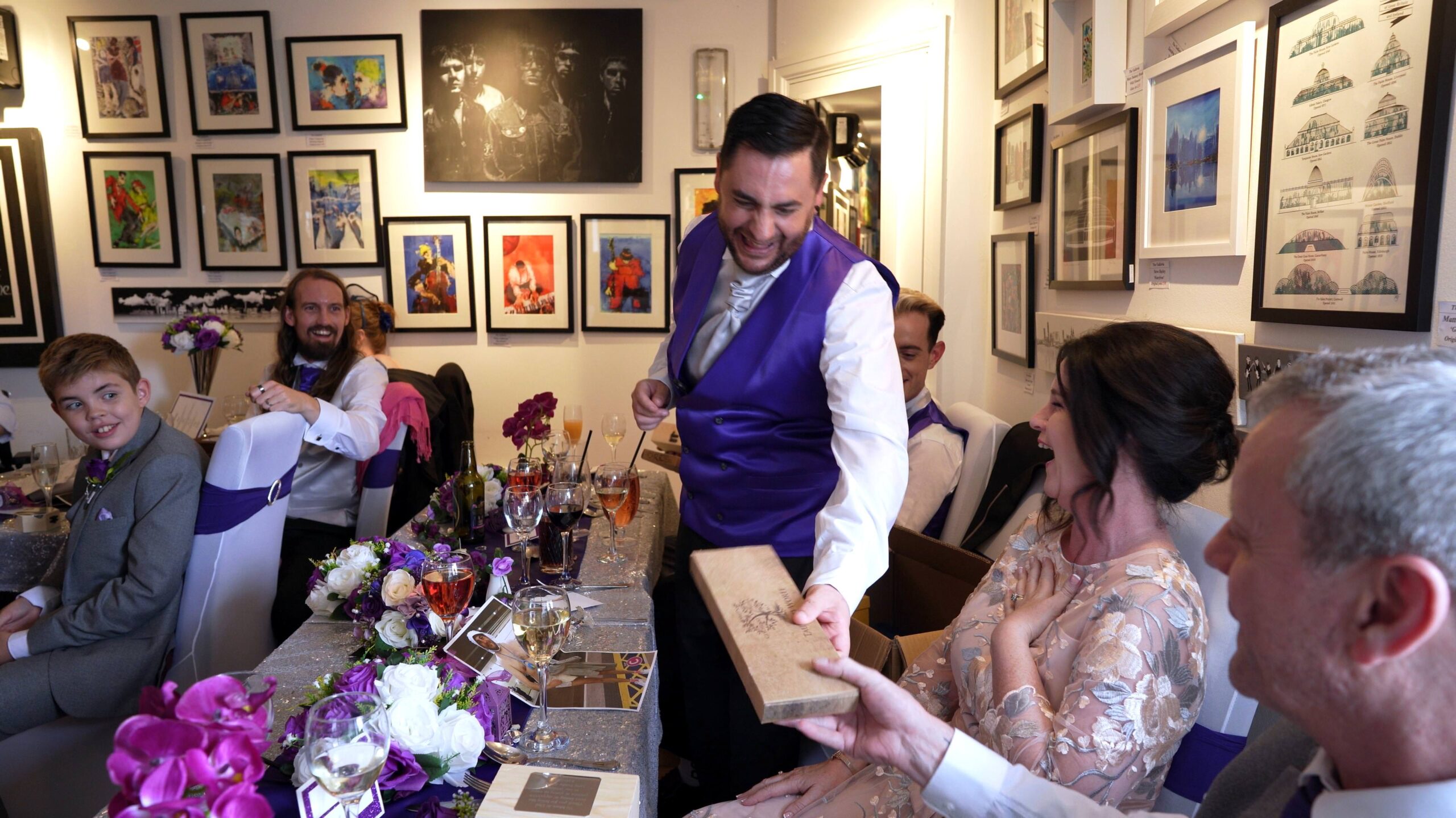 groom gives out parents gifts