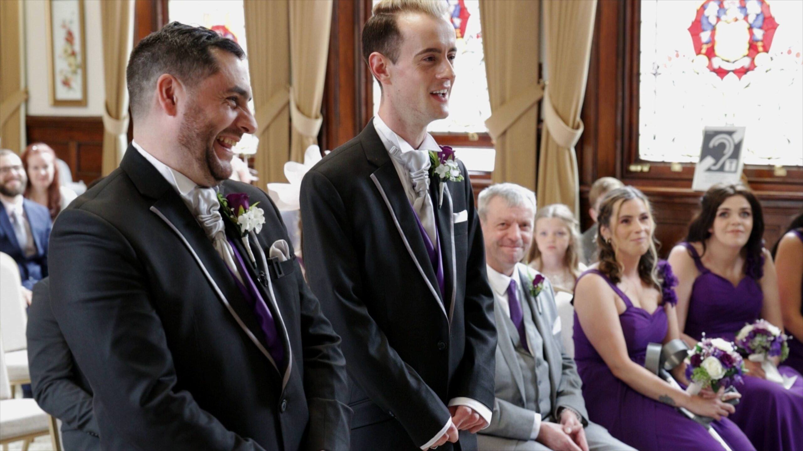 grooms laugh during civil ceremony at st helens town hall