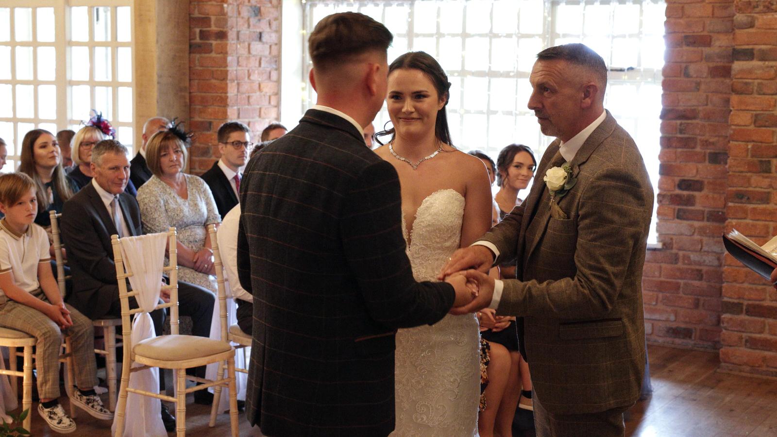 dad hands over bride at the start of the Charnock Farm ceremony