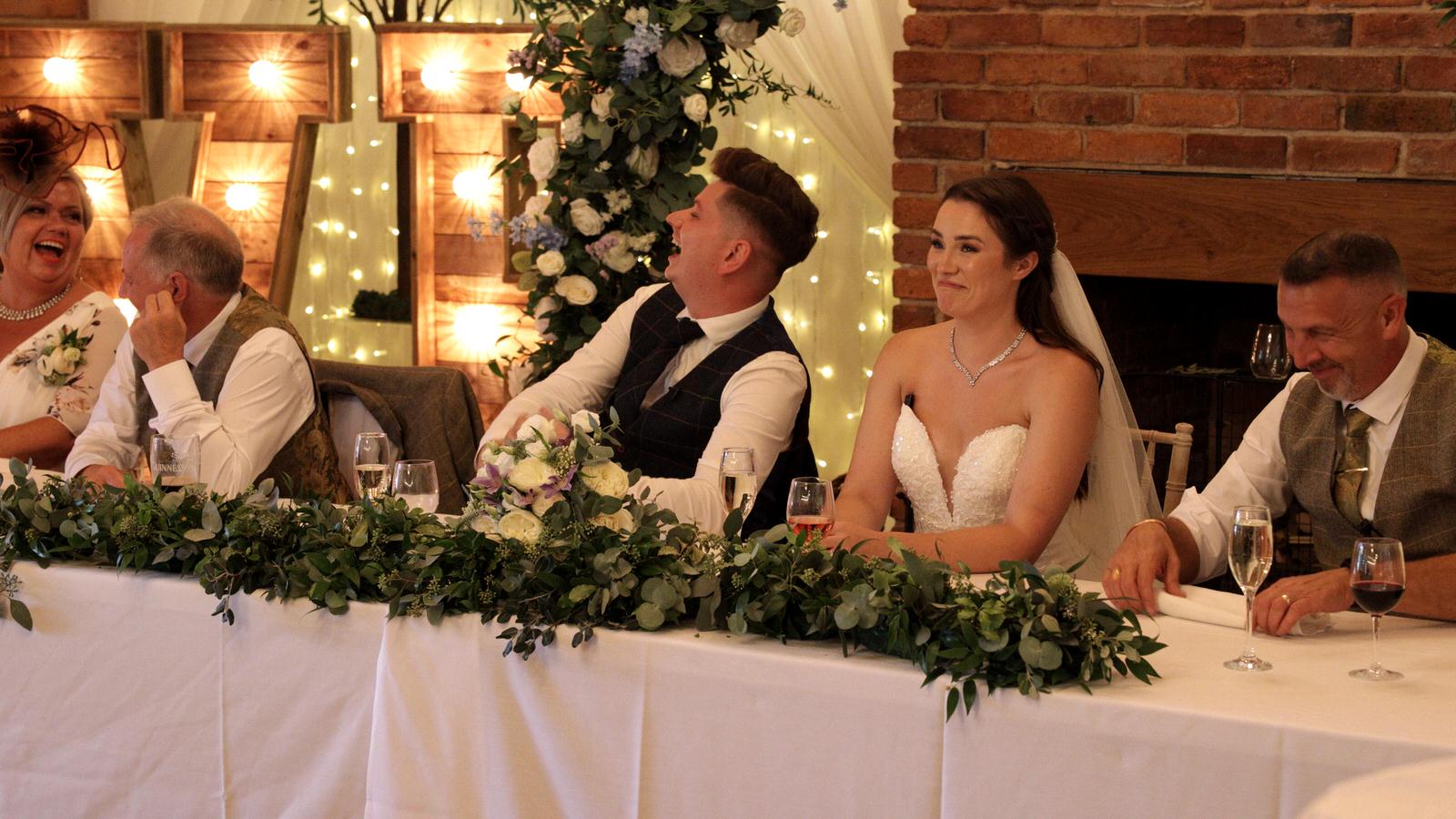 top table laughing at best man speech in Charnock Farm